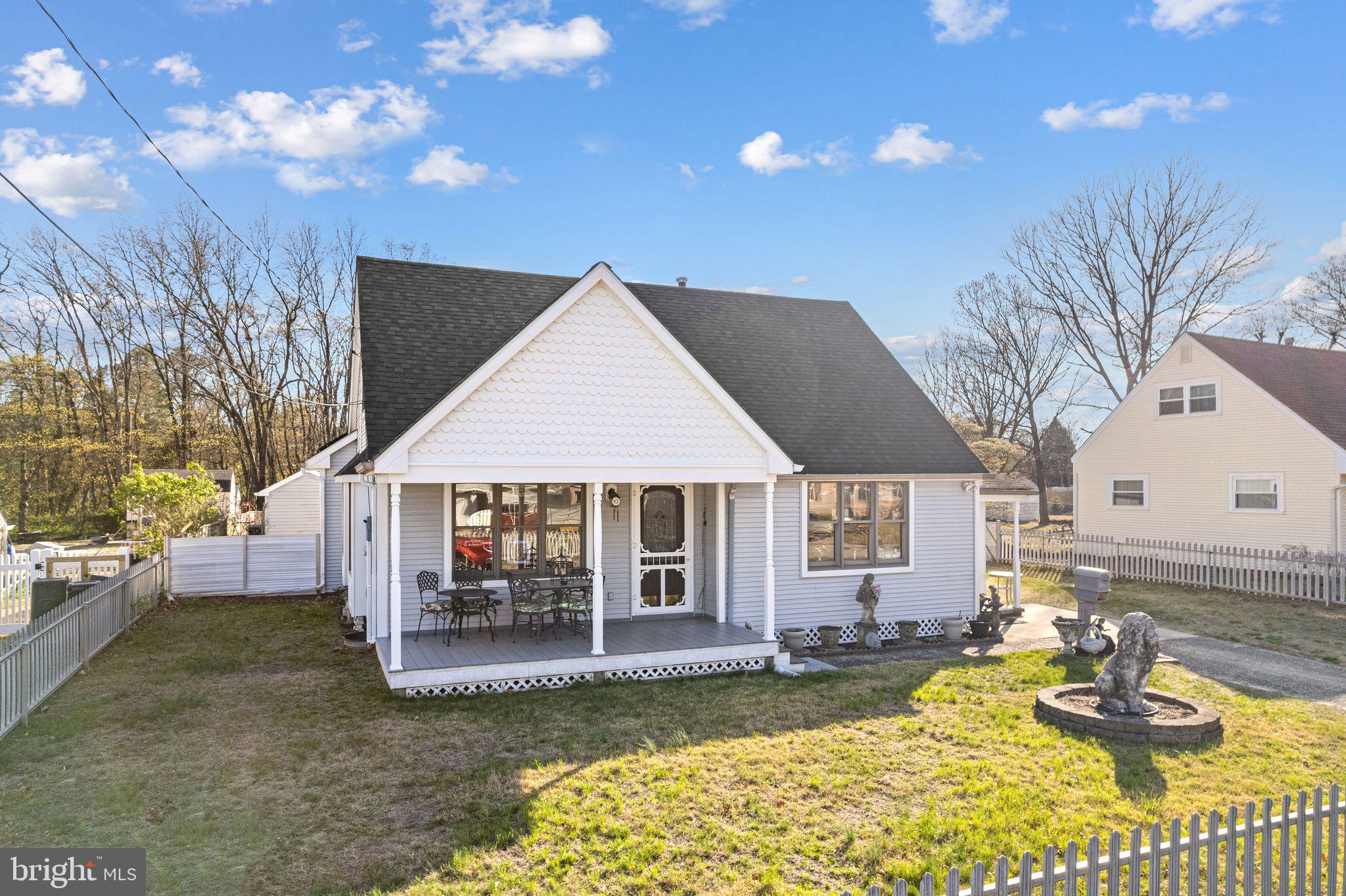 91 Estates Road Pine Hill, NJ 08021 - Photo 3 of 34 a view of a house with a yard patio and fire pit