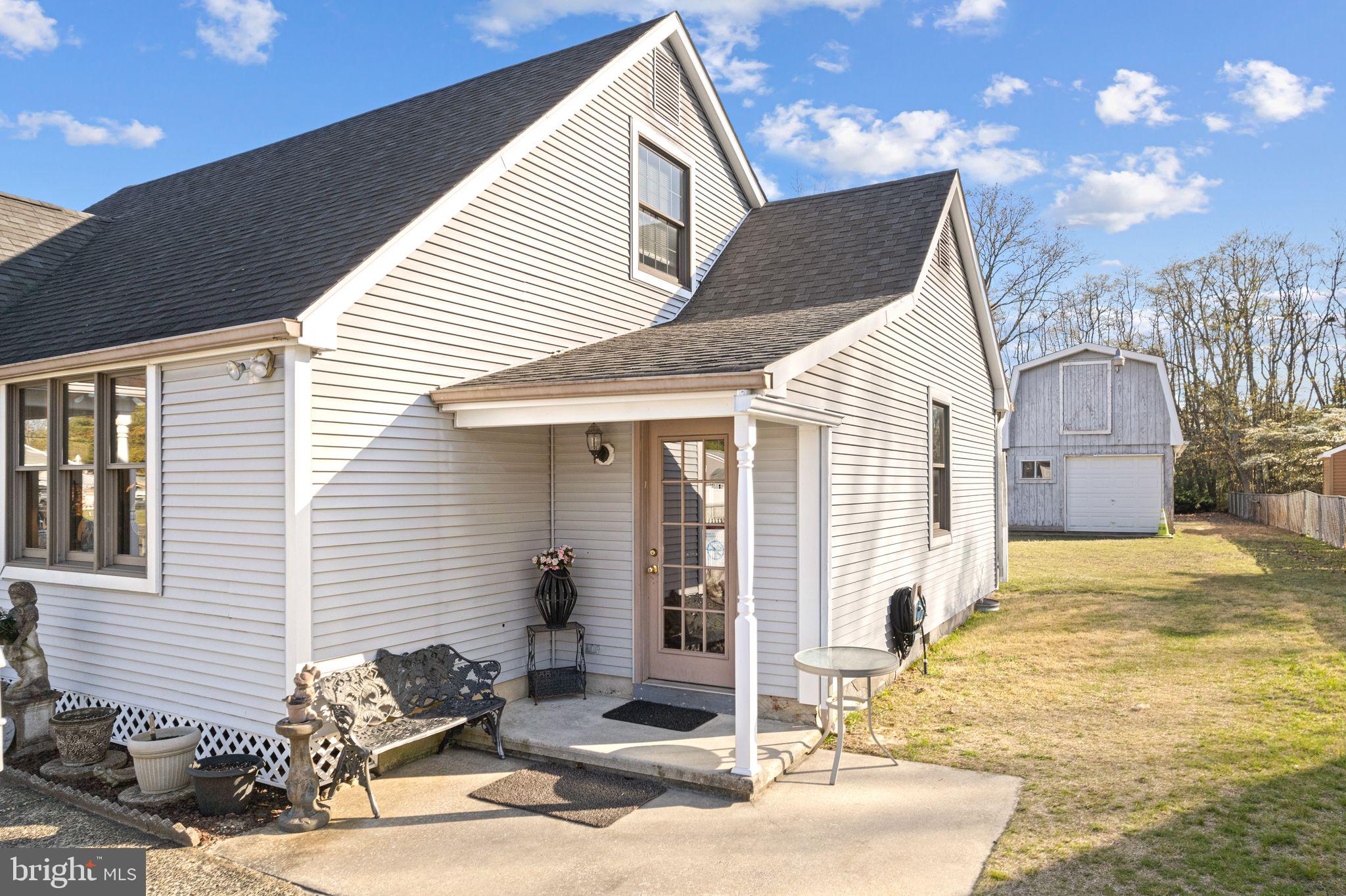 91 Estates Road Pine Hill, NJ 08021 - Photo 4 of 34 a view of a house with a patio