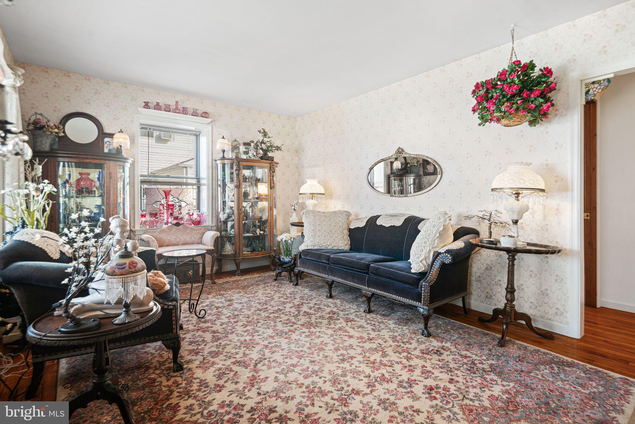 91 Estates Road Pine Hill, NJ 08021 - Photo 6 of 34 a living room with furniture and flowers