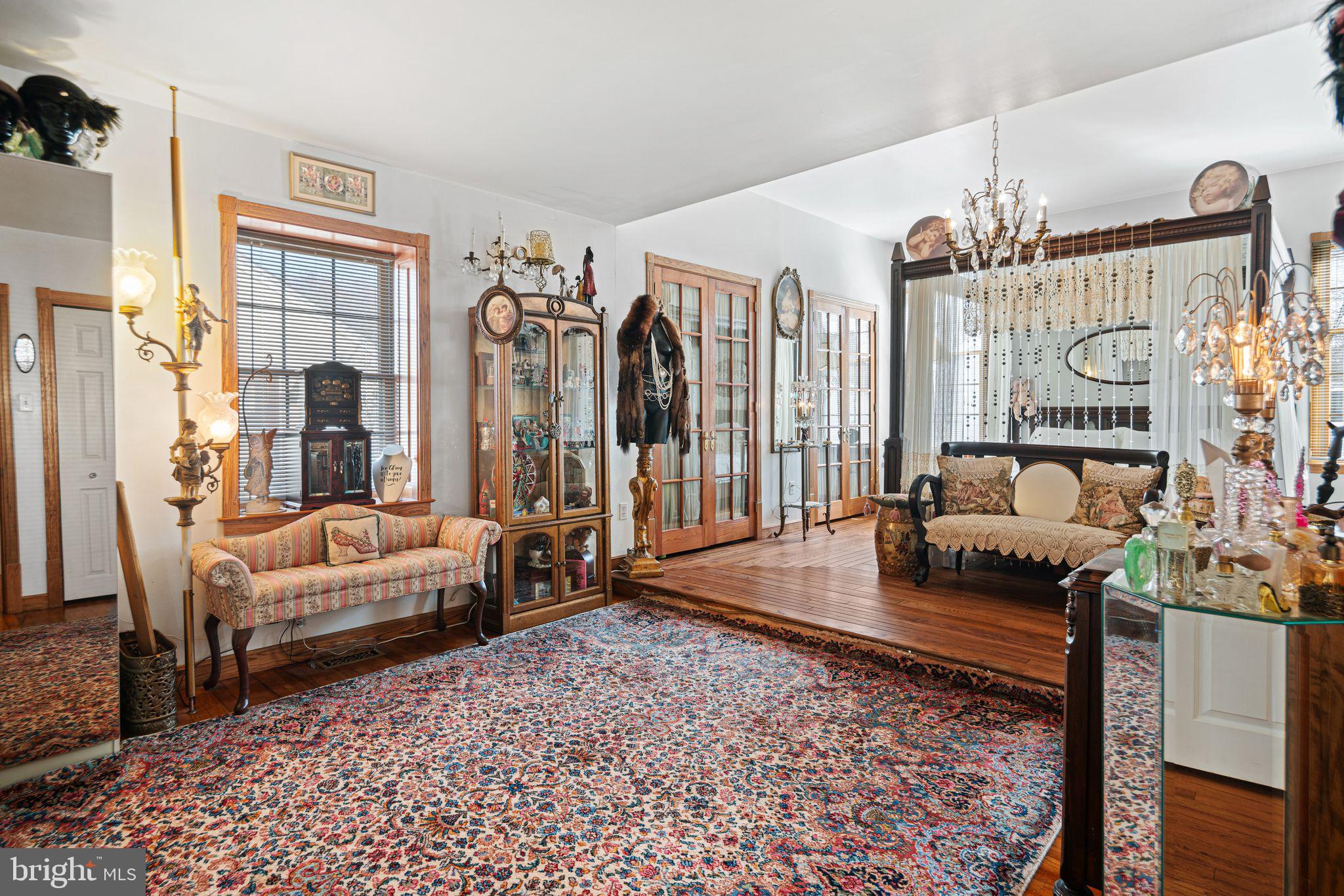 91 Estates Road Pine Hill, NJ 08021 - Photo 8 of 34 a living room with furniture or couch and a chandelier