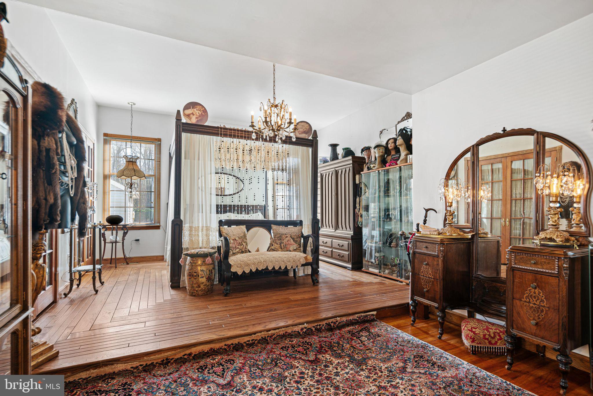 91 Estates Road Pine Hill, NJ 08021 - Photo 9 of 34 a view of living room filled with furniture hardwood floor and a chandelier