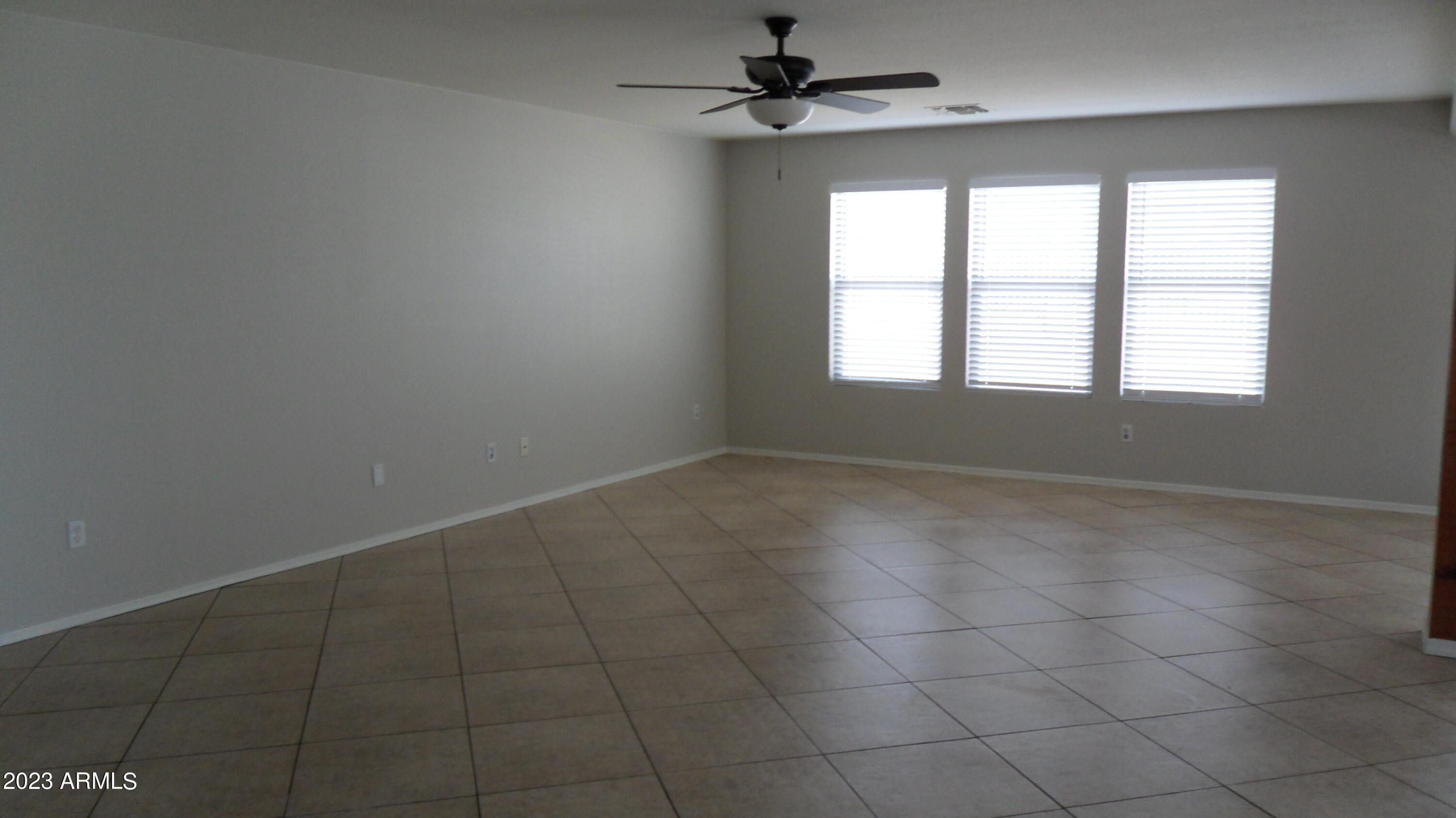 9304 West Coolidge Street Phoenix, AZ 85037 - Photo 4 of 18 huge family room/great room