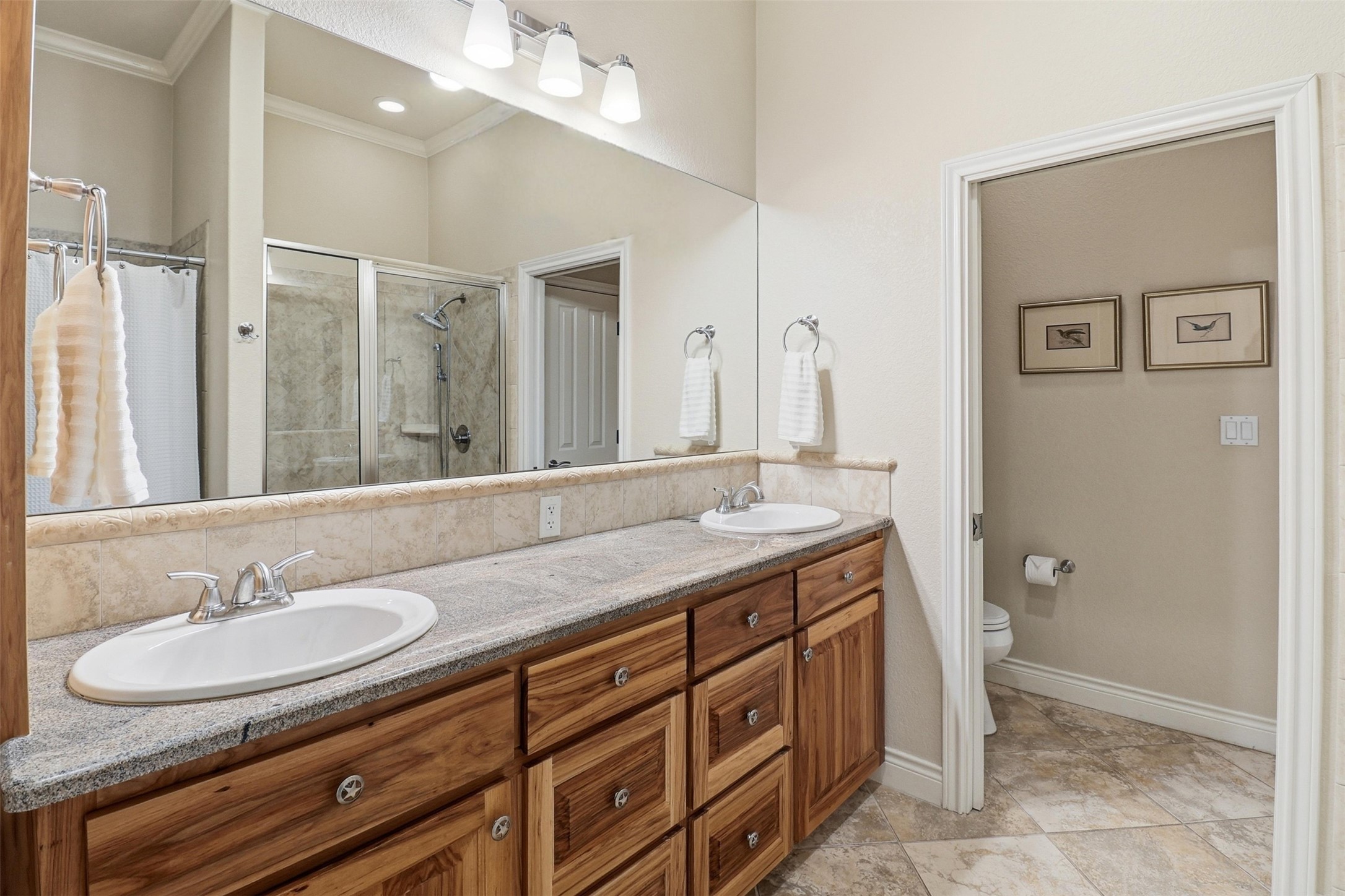 450 Threadgill Ranch Road Burnet, TX 78611 - Photo 15 of 33 a bathroom with a sink double vanity and a mirror