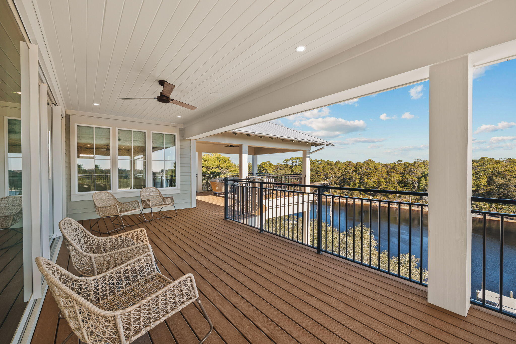 157 Blue Lake Road Santa Rosa Beach, FL 32459 - Photo 77 of 83 a view of balcony with couch and wooden floor
