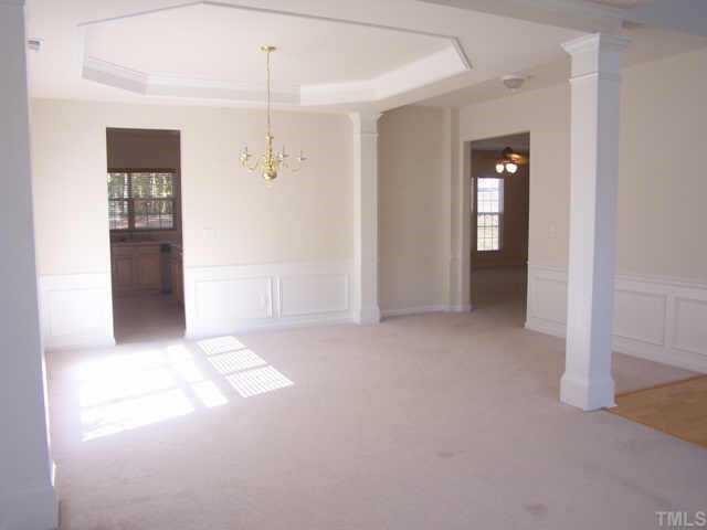 1633 October Road Raleigh, NC 27614 - Photo 3 of 10 a view of a hallway with wooden shelves