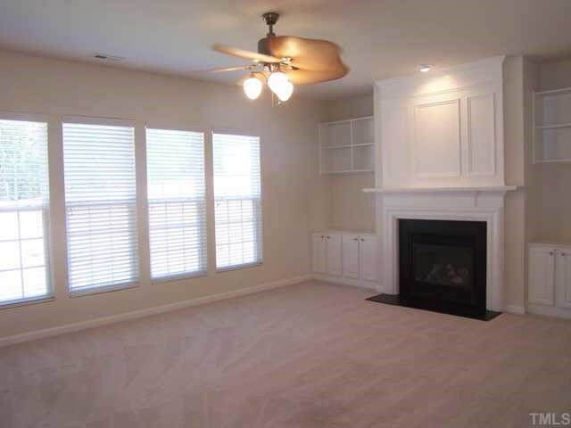 1633 October Road Raleigh, NC 27614 - Photo 4 of 10 a view of livingroom with fan window and fireplace
