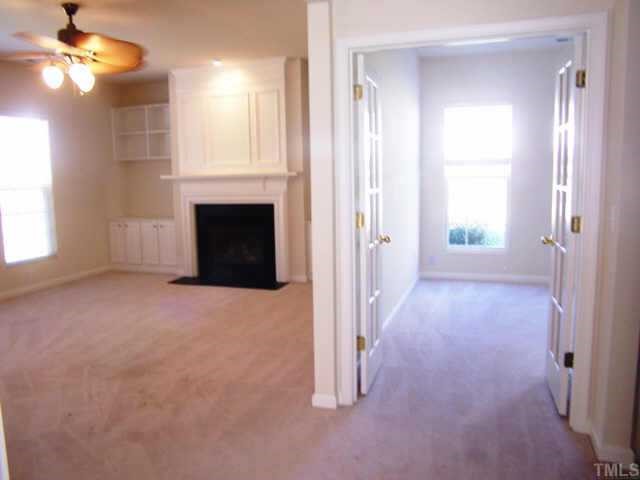 1633 October Road Raleigh, NC 27614 - Photo 7 of 10 a view of a livingroom with a fireplace and window