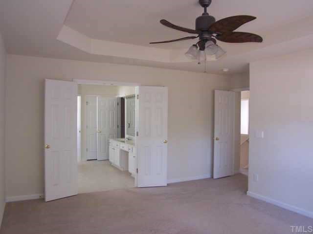 1633 October Road Raleigh, NC 27614 - Photo 8 of 10 an empty room and chandelier fan