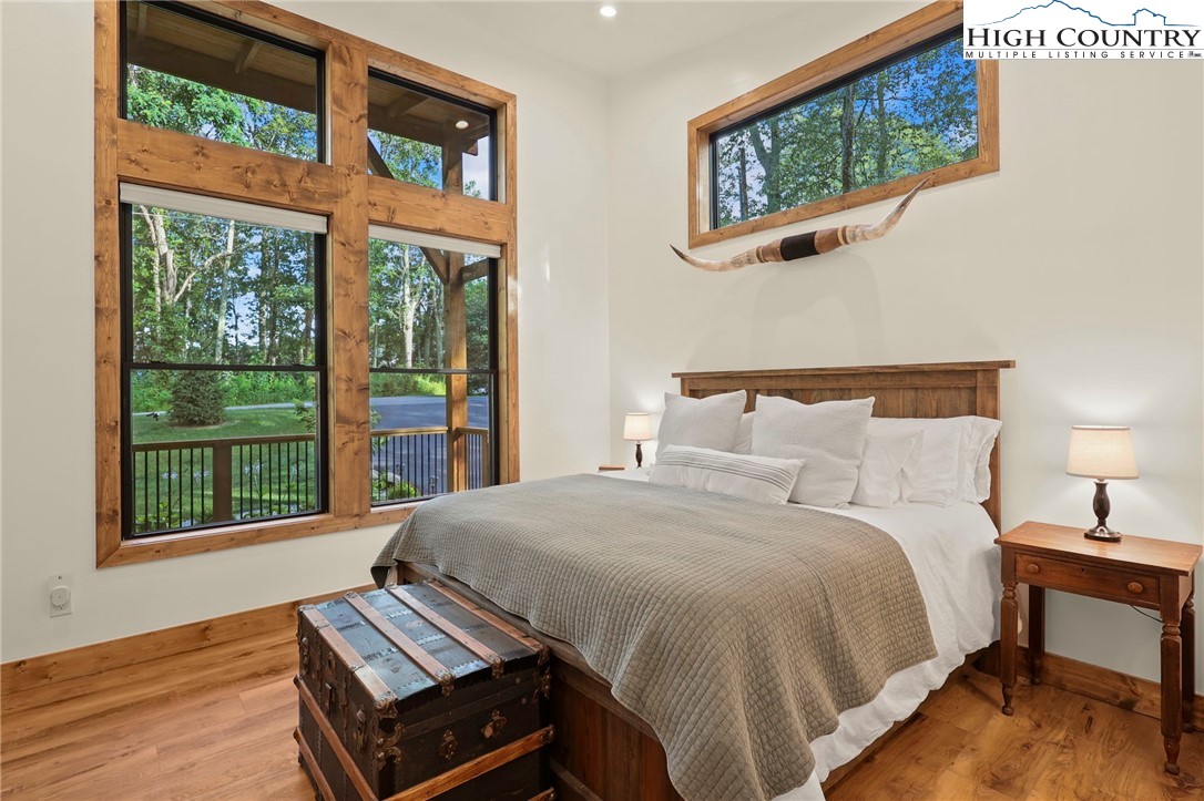 10 Maple Lane Newland, NC 28657 - Photo 15 of 22 a bed sitting in a bedroom next to a window
