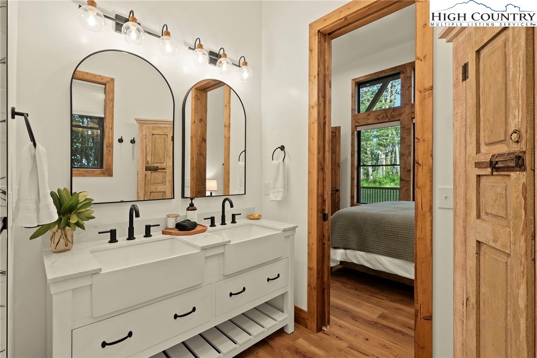 10 Maple Lane Newland, NC 28657 - Photo 18 of 22 a en suite bathroom with a double vanity sink and a mirror