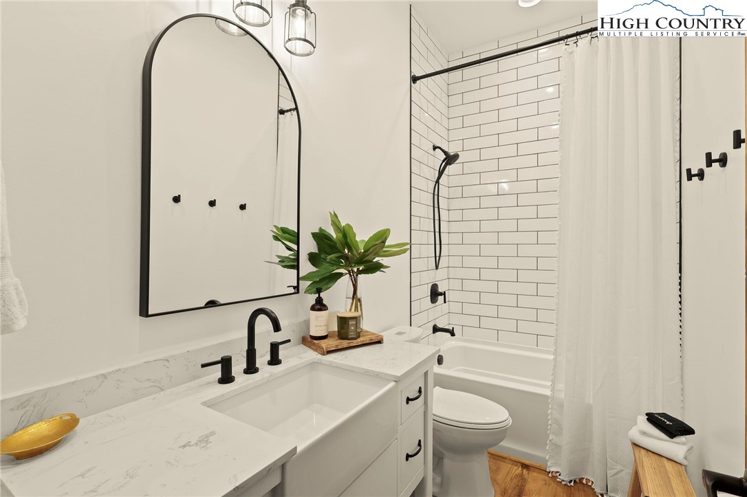 10 Maple Lane Newland, NC 28657 - Photo 20 of 22 a bathroom with a sink toilet and shower