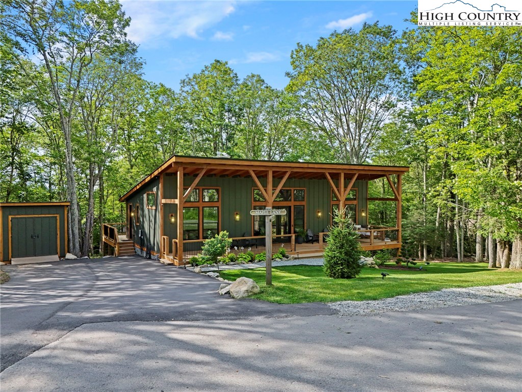 10 Maple Lane Newland, NC 28657 - Photo 2 of 22 a front view of a house with garden