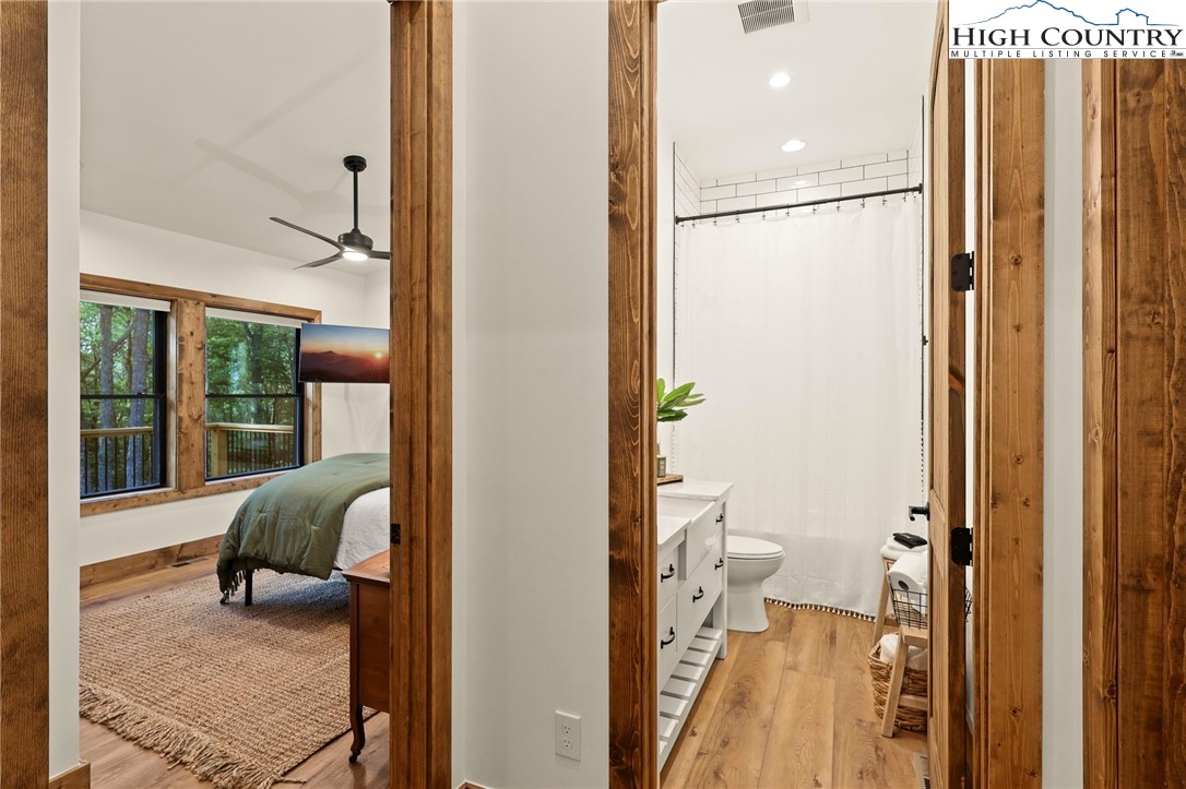 10 Maple Lane Newland, NC 28657 - Photo 22 of 22 a en suite bathroom with a granite countertop shower and a toilet