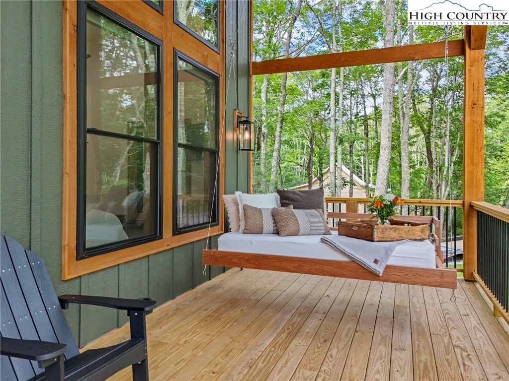 10 Maple Lane Newland, NC 28657 - Photo 4 of 22 a living room with a large window and floor to ceiling windows