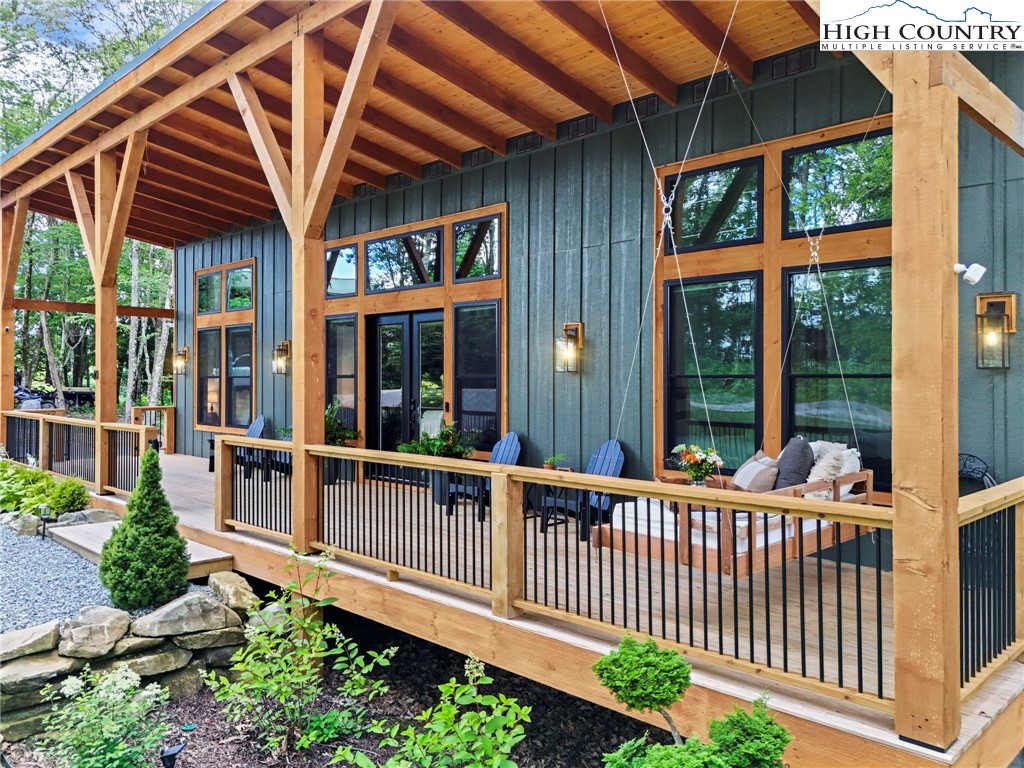 10 Maple Lane Newland, NC 28657 - Photo 6 of 22 a view of a house with porch and wooden floor