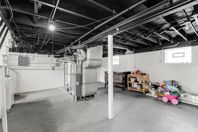 a view of storage and utility room with racks on the wall