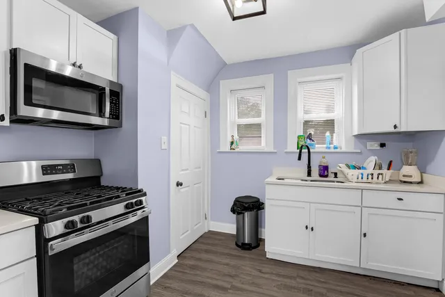 a kitchen with a stove and a microwave