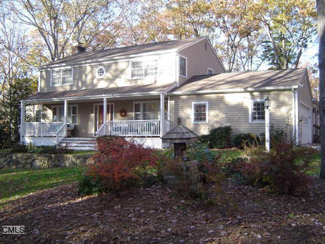 28 Tubbs Spring Drive Weston, CT 06883 - Photo 1 of 1 a front view of a house with garden