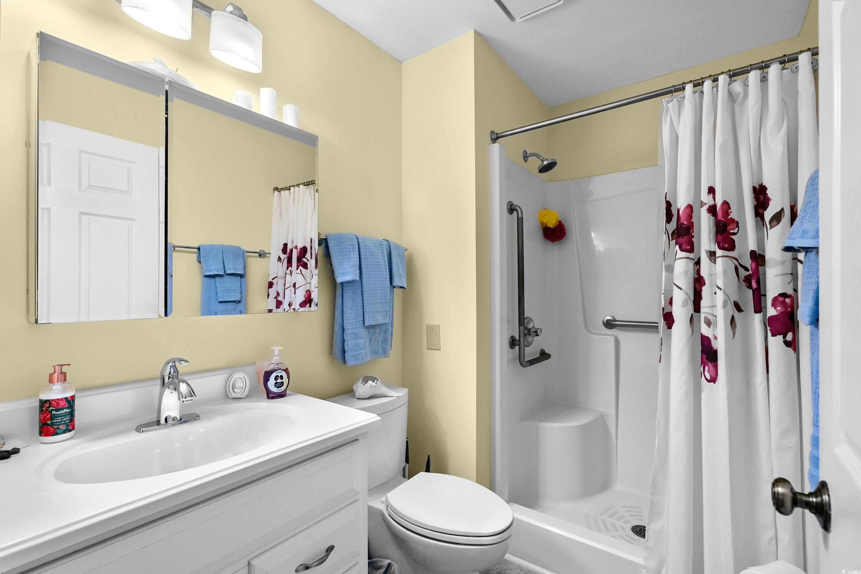 5001 Little River Road, Unit E219 Myrtle Beach, SC 29577 - Photo 20 of 34 Bathroom featuring a shower with shower curtain, v