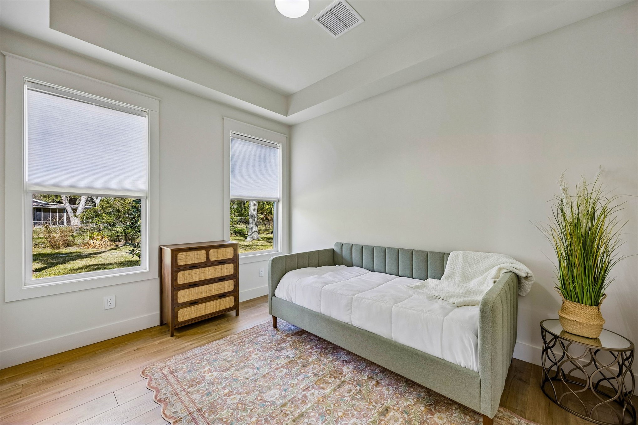 424 South 3rd Street Fernandina Beach, FL 32034 - Photo 11 of 38 a bedroom with a bed and a window