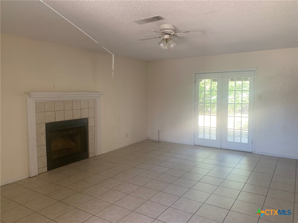 2011 Hinkle Avenue Killeen, TX 76549 - Photo 3 of 6 a view of an empty room with a fireplace and a window