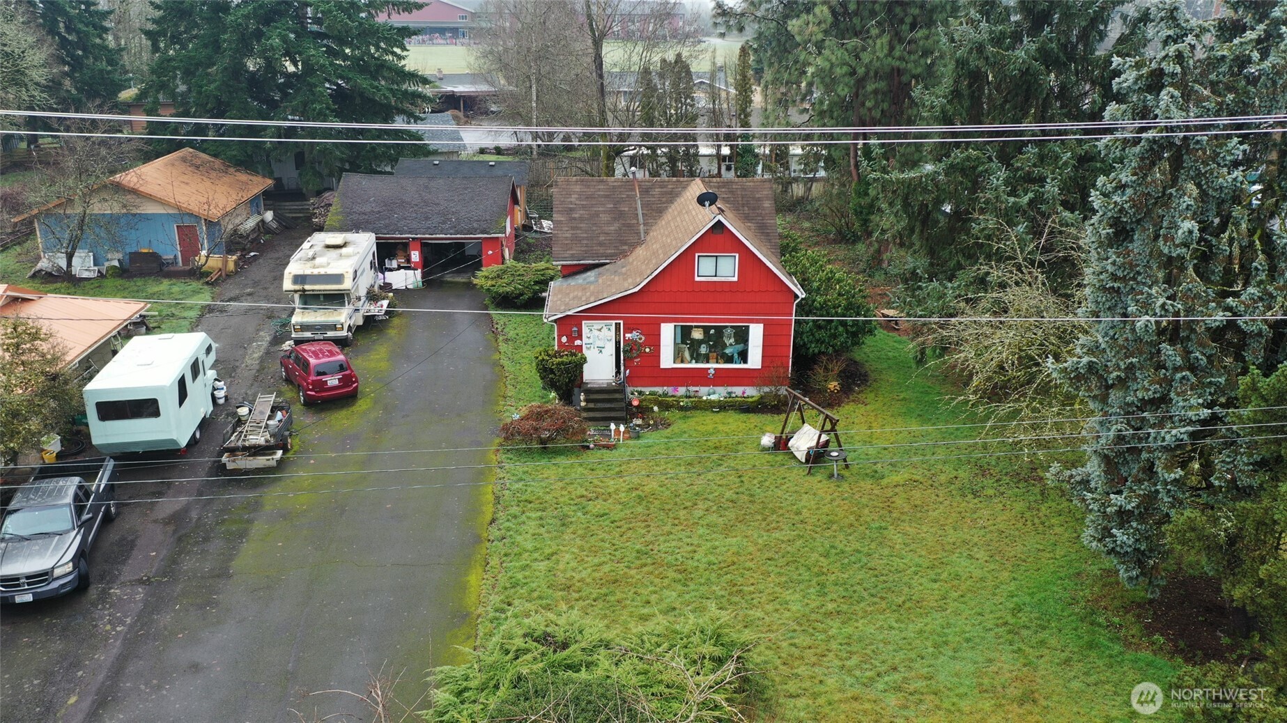 1865 Southwest Fair Avenue Chehalis, WA 98532 - Photo 2 of 15 a sign that is sitting in front of a house with a yard