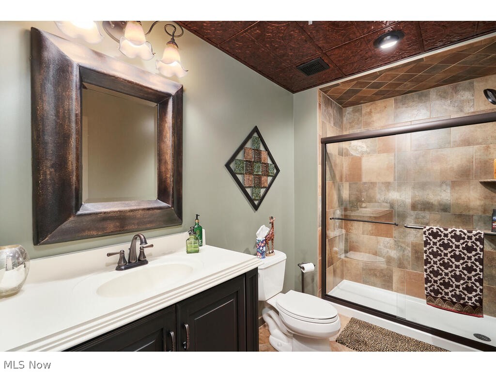 3735 Roberts Ridge Akron, OH 44333 - Photo 28 of 45 Lower Level Full Bathroom featuring a shower with door, toilet, and vanity