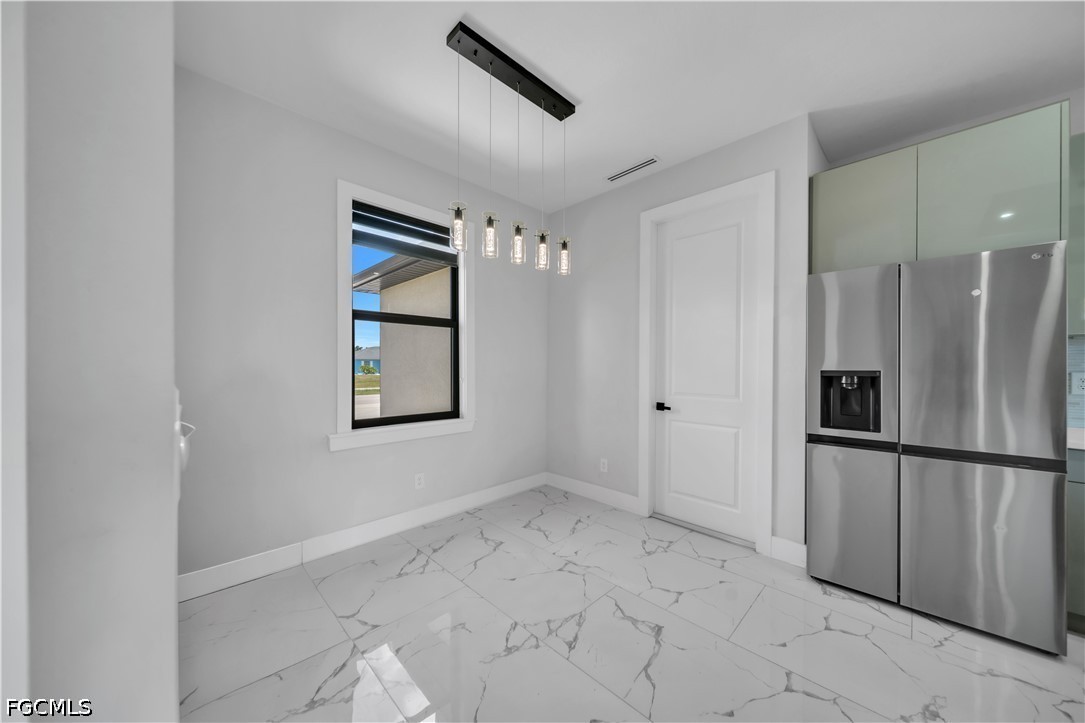 1128 Nelson Road North Cape Coral, FL 33993 - Photo 9 of 22 a view of an empty room with a window