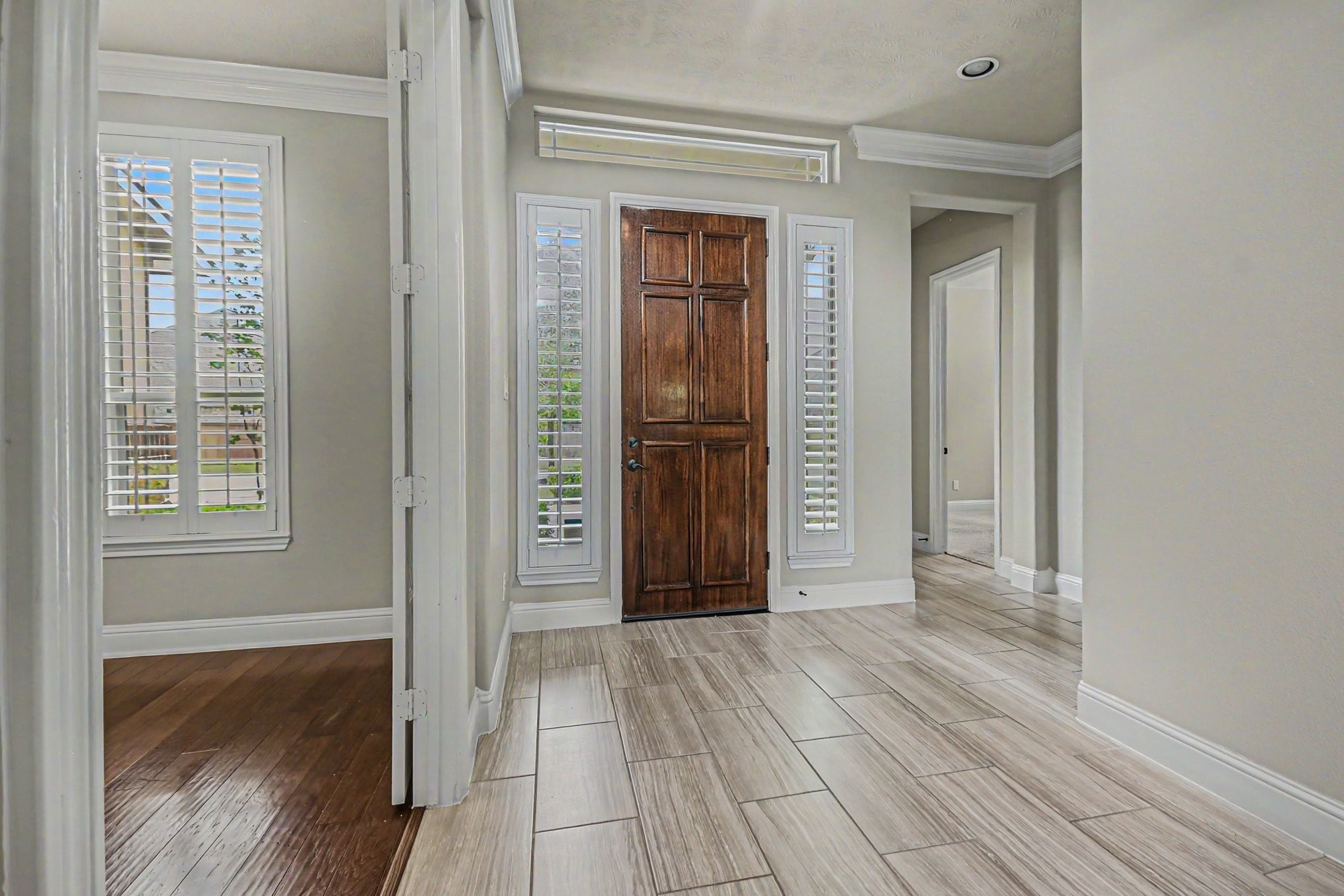 3310 Ralston Edge Lane Houston, TX 77059 - Photo 8 of 50 a view of a hallway with wooden floor and a bathroom