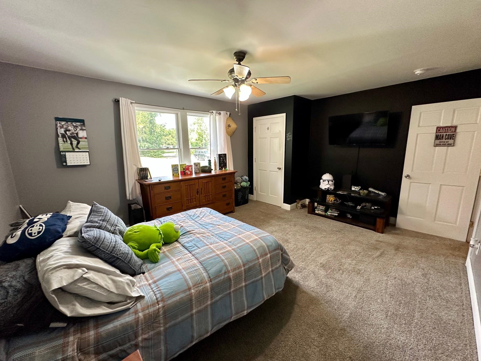 126 Newell Road Heislerville, NJ 08324 - Photo 14 of 20 a bedroom with a bed and a chandelier