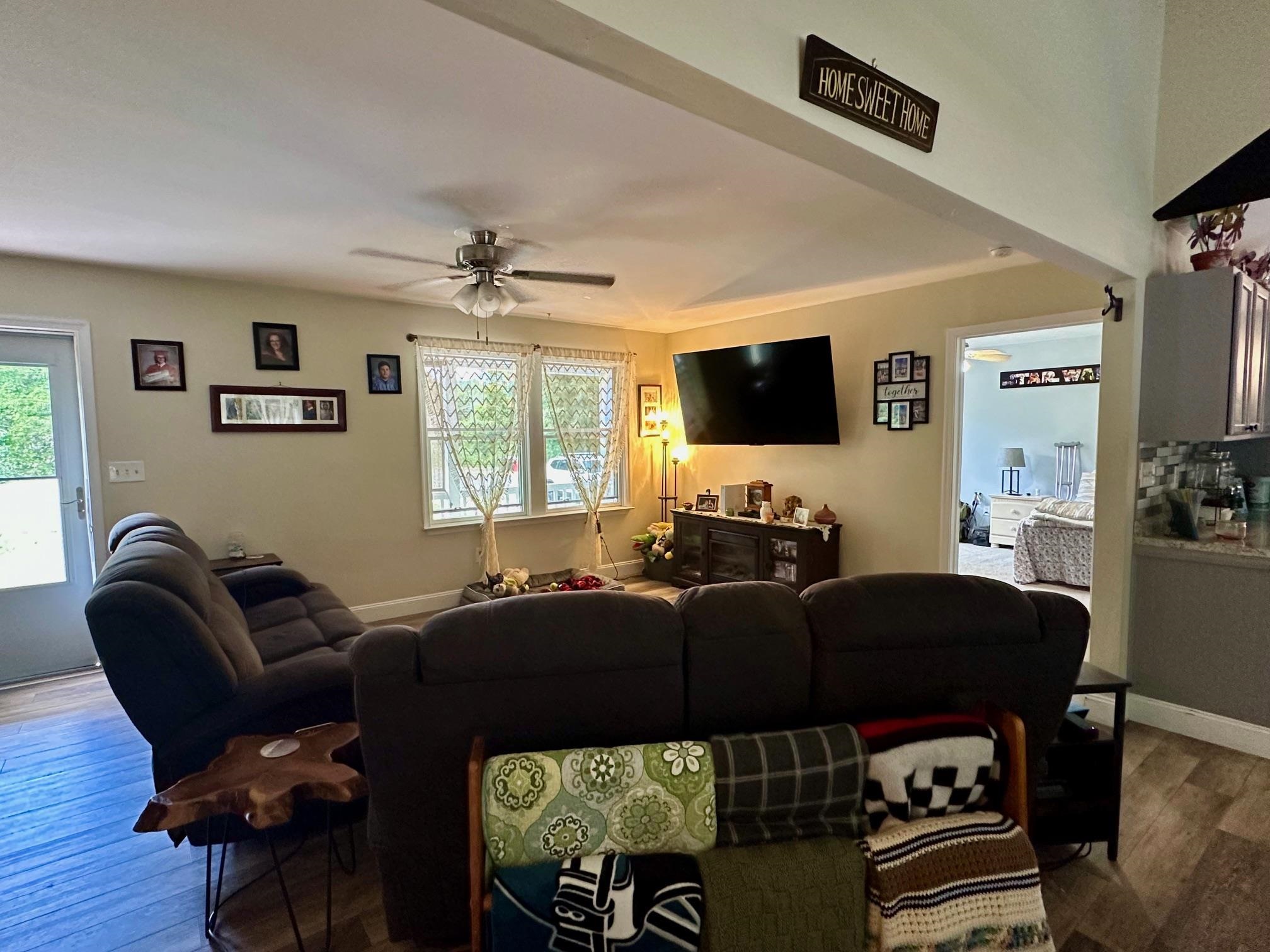 126 Newell Road Heislerville, NJ 08324 - Photo 3 of 20 a living room with furniture a ceiling fan and a window