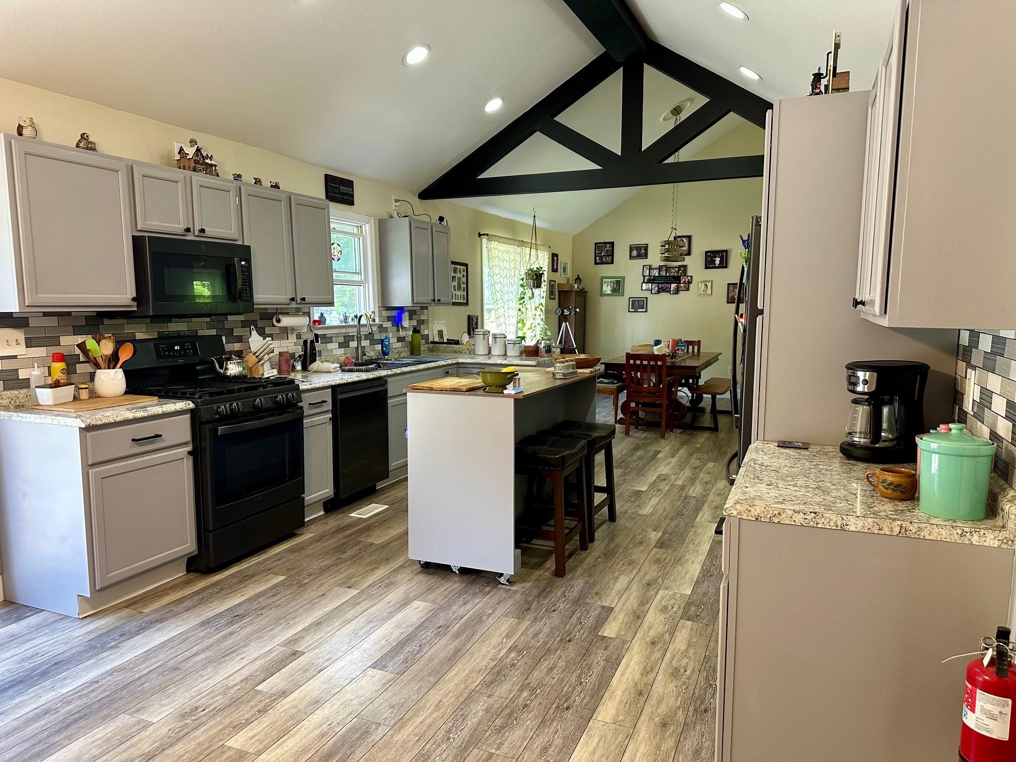 126 Newell Road Heislerville, NJ 08324 - Photo 6 of 20 a kitchen with a sink cabinets and wooden floor