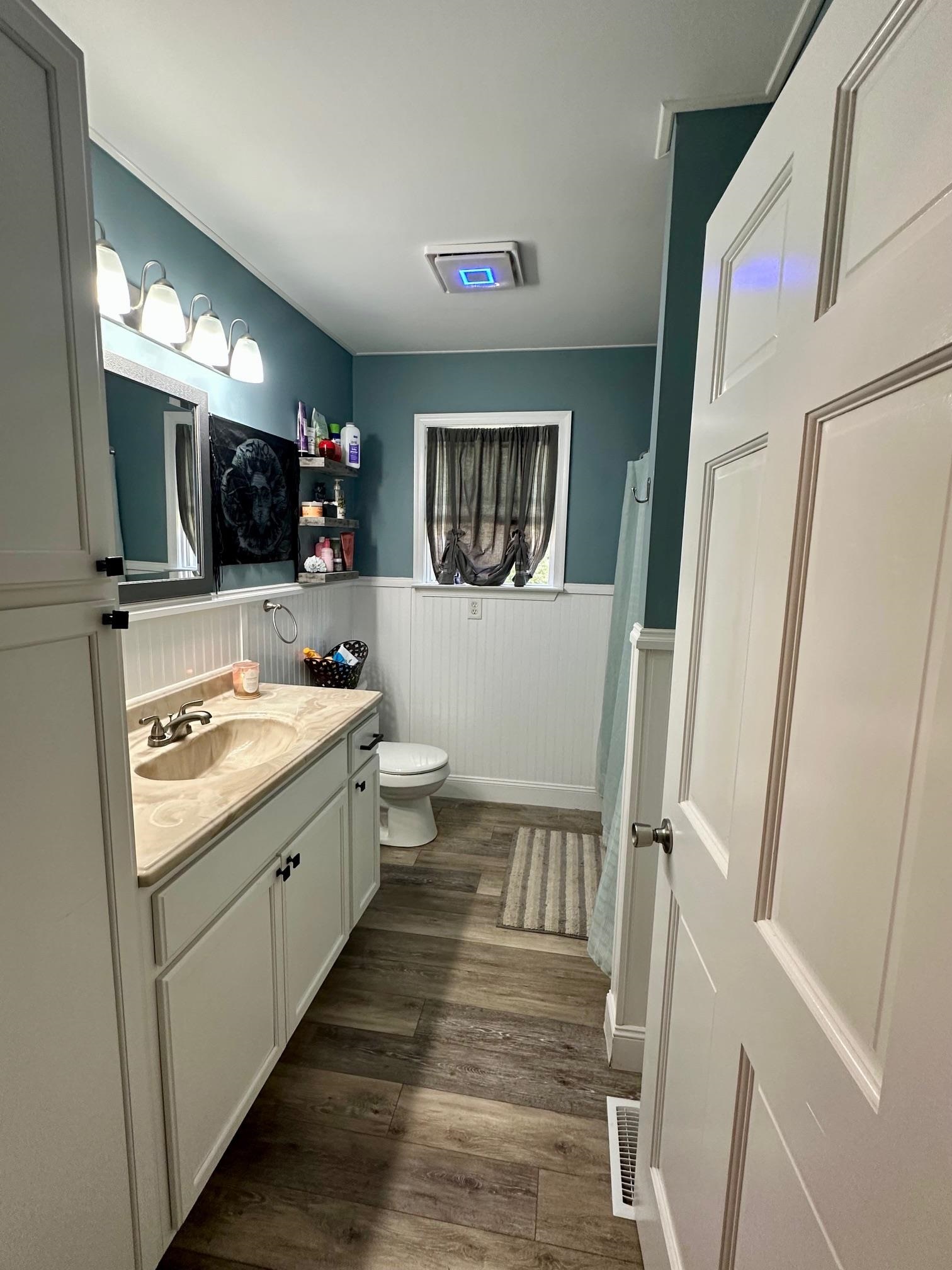 126 Newell Road Heislerville, NJ 08324 - Photo 9 of 20 a bathroom with a sink a mirror and a toilet