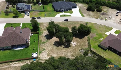 an aerial view of house with yard
