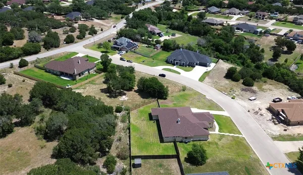 an aerial view of houses with yard
