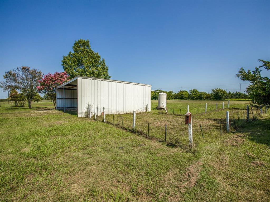 290 East Forest Grove Road Lucas, TX 75002 - Photo 7 of 8 a backyard of a house with lots of green space and garden view