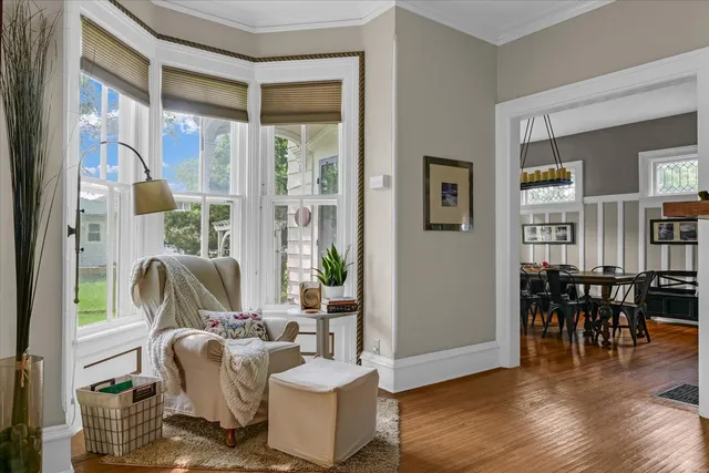 a living room with furniture and a lamp