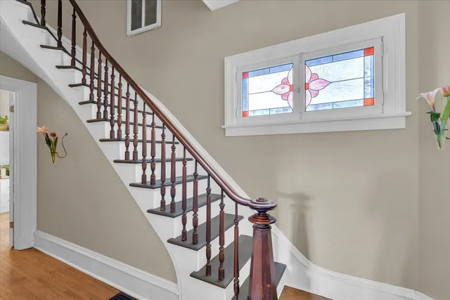 a living room with furniture and a book shelf
