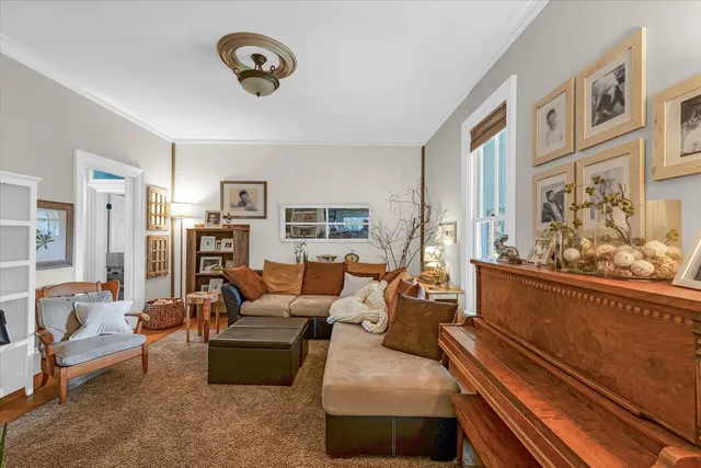 a large white kitchen with stainless steel appliances granite countertop a sink and cabinets