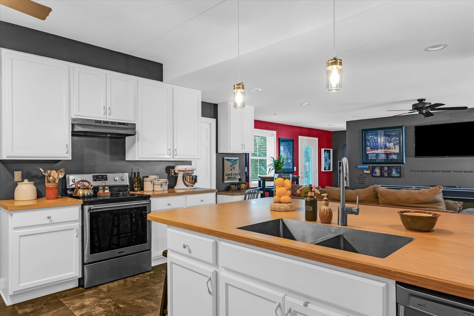 320 East Locust Street Watseka, IL 60970 - Photo 45 of 95 a kitchen with granite countertop a sink stainless steel appliances and cabinets