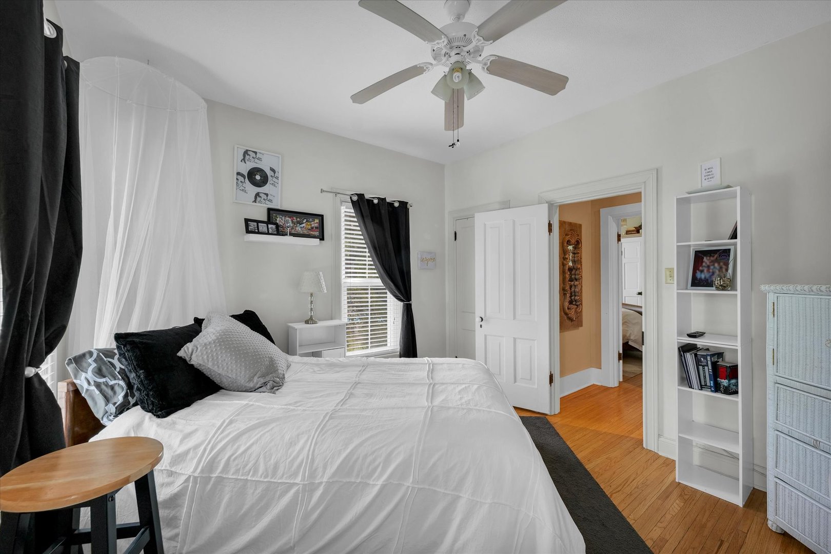 320 East Locust Street Watseka, IL 60970 - Photo 70 of 95 a bedroom with a bed and a chandelier