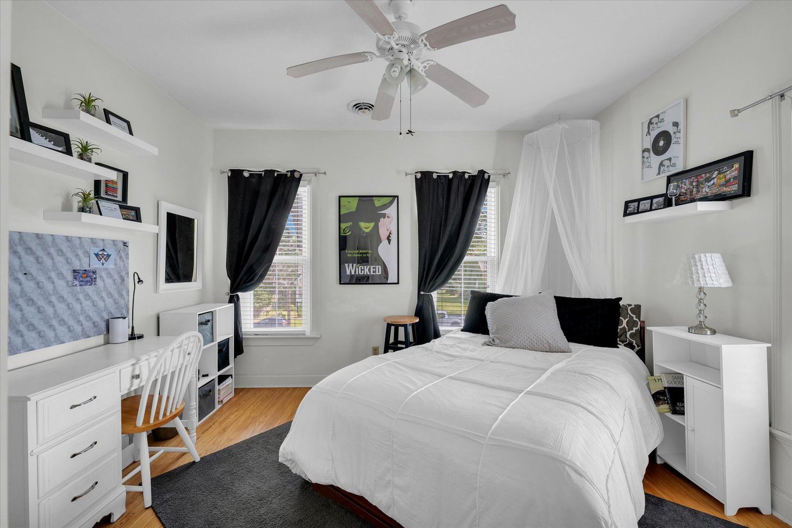 320 East Locust Street Watseka, IL 60970 - Photo 71 of 95 a bedroom with a bed tv and a large mirror