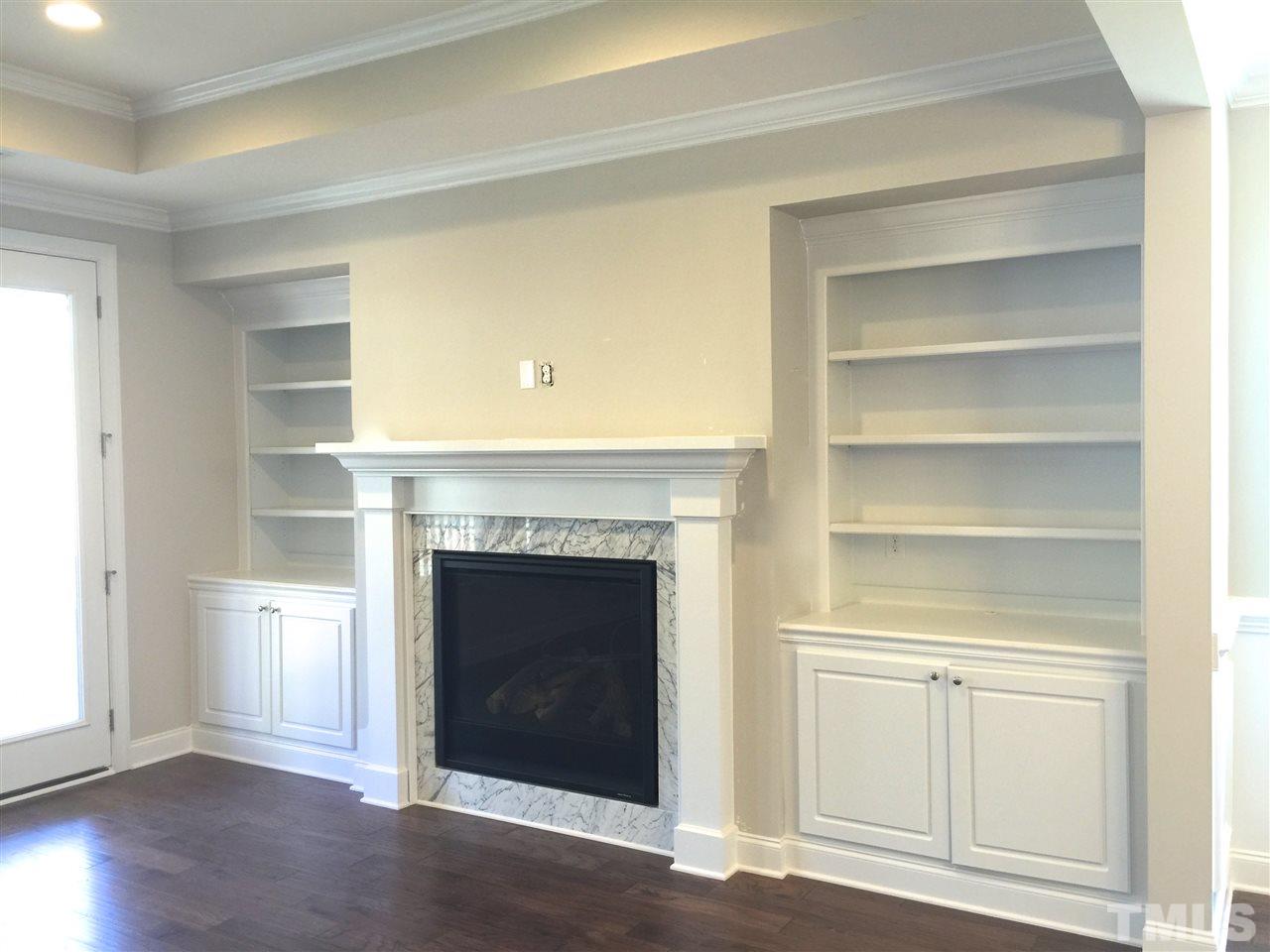 8113 Greys Landing Way, Unit 8 Raleigh, NC 27615 - Photo 7 of 25 Large family room with built in bookshelves