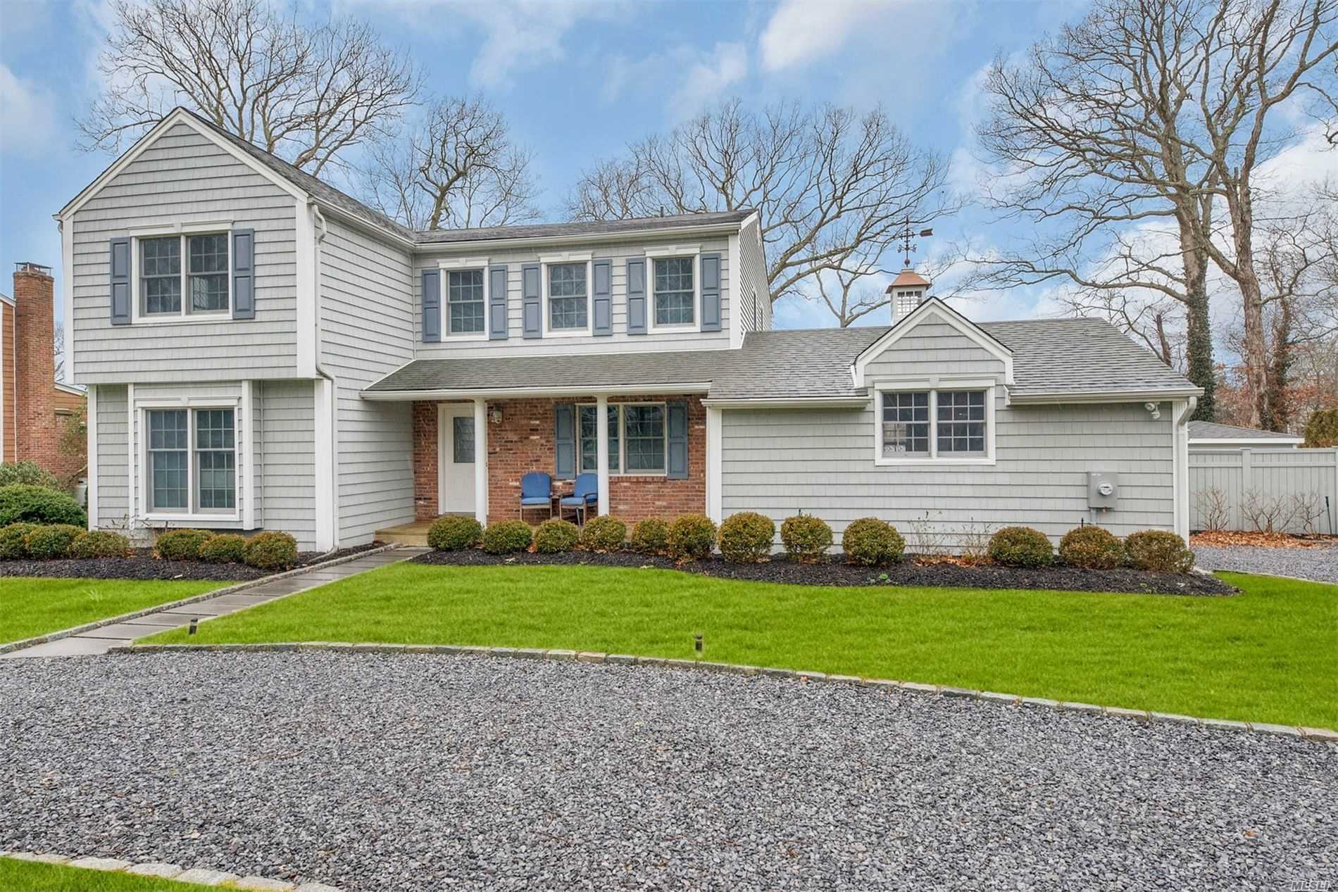 15 Harbor Road Hampton Bays, NY 11946 - Photo 1 of 1 a front view of a house with a yard and garage
