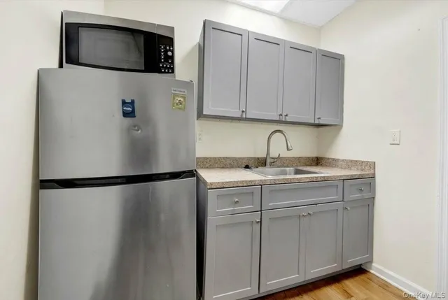 a bedroom with furniture and a potted plant