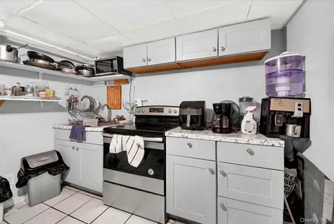 a kitchen with a stove and cabinets