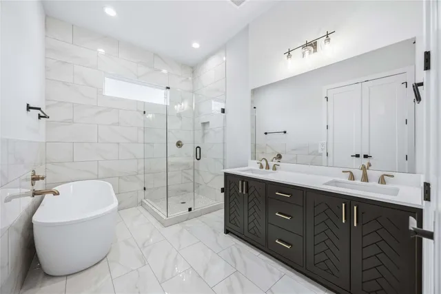 a bathroom with double vanity sink and mirror