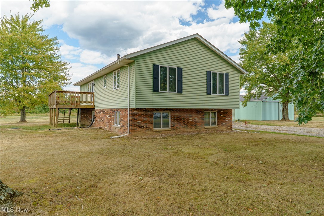 6747 Giddings Road Rootstown, OH 44272 - Photo 4 of 39 Left view of front of home showing wood deck off kitchen