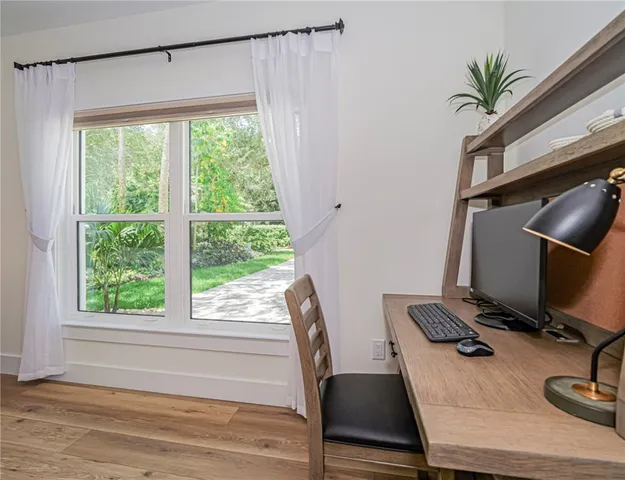 a workspace with furniture and window