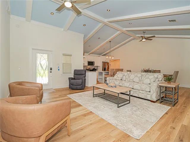 a living room with furniture and a rug